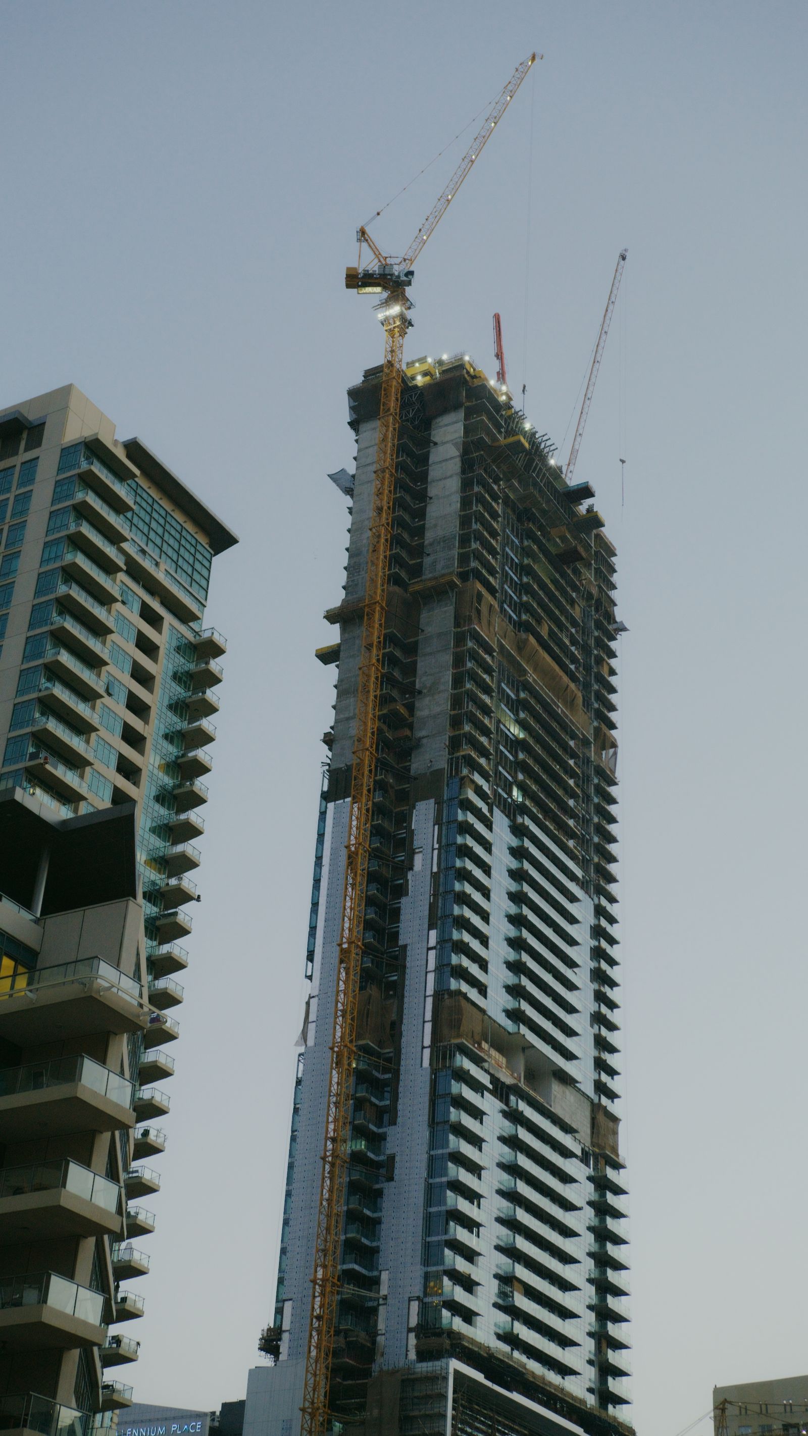 High-rise construction site with tower cranes