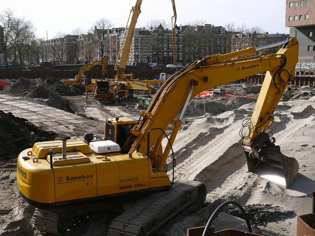 Tracked hydraulic excavator working on a construction site