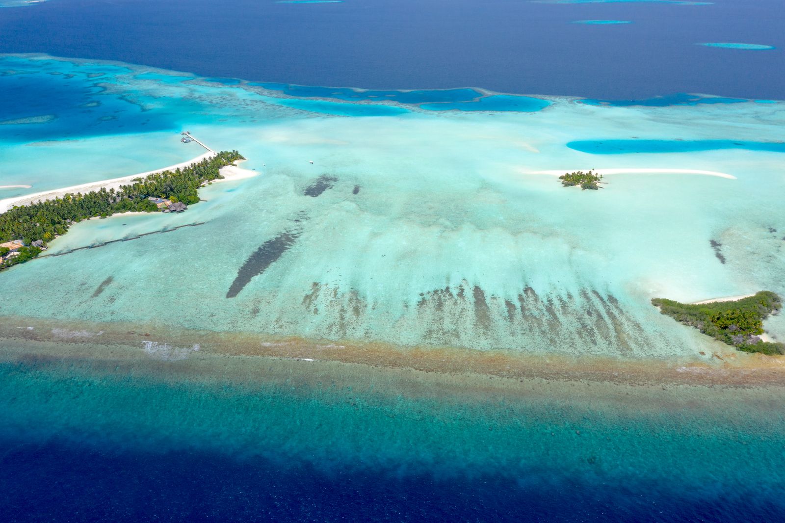 A Maldivian island and lagoon — the setting for One Residence on Maafushi